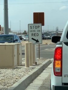 Truck approaching Stop on Red sign