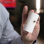 Sandia geoscientist holds a fractured 3D-printed rock. 