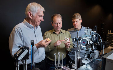 scientists evaluate metal sample with tabletop laser system