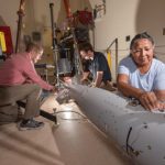 engineers place sensors on B61-12 test unit