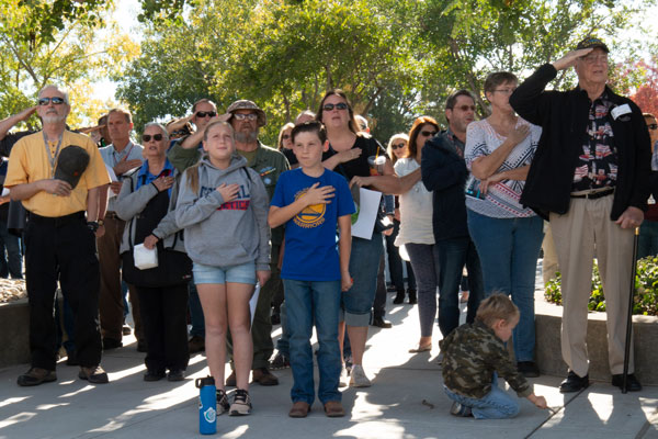 crowd performs pledge of allegiance