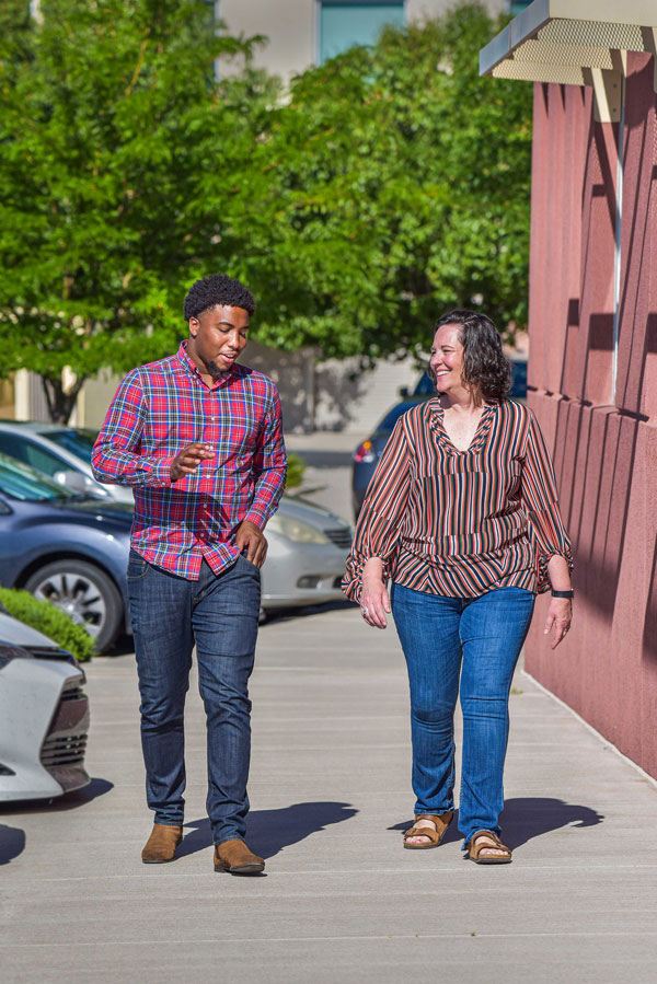 Logan Carpenter and Tommie Kuykendall walk on Sandia campus