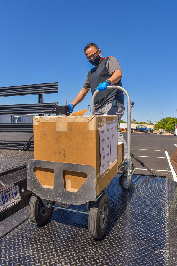 man unloading box from truck