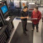 Employees work together in Sandia’s Distributed Energy Technologies Laboratory