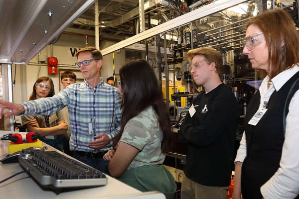 scientist talks to students