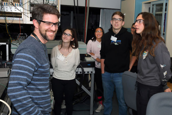 scientist talks to students