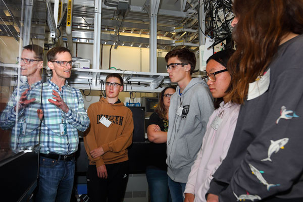 scientist talks to students