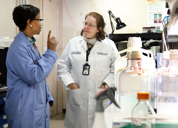 Cagle tours Cathy Branda's Sandia laboratory