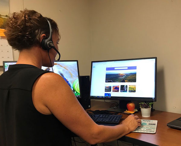 health educator conducts virtual wellness visit with employee