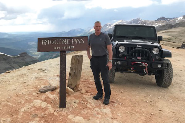 Harry Cincotta and his Jeep on mountain pass