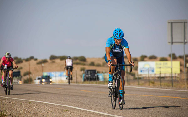 Sara on bike during triathlon