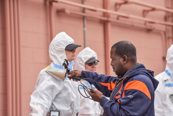 technician scans emergency responder for radiation