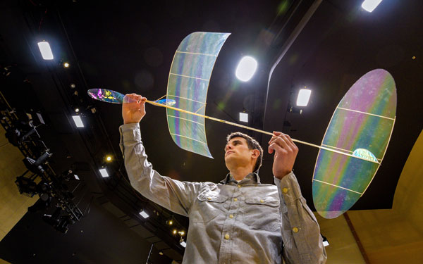 Brett Sanborn holds his indoor rubber-powered aircraft