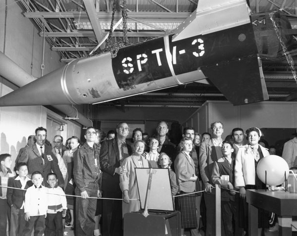 1959 family day visitors look up at test vehicle