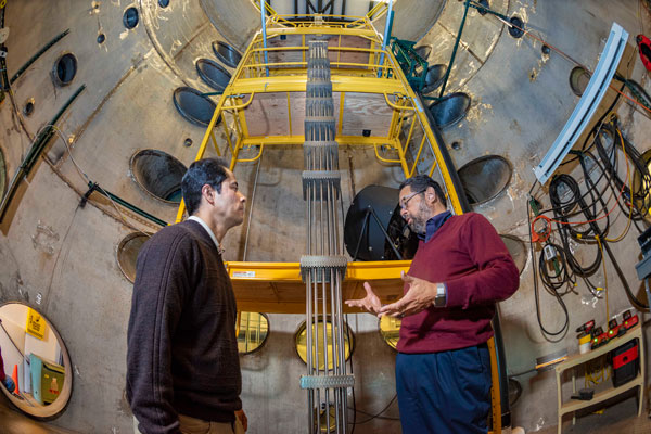 researchers stand in solar energy facility