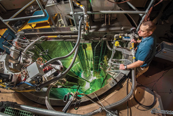scientist checks Sandia reactor