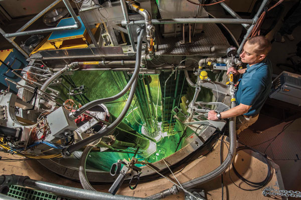 researcher looks over Annular Core Research Reactor