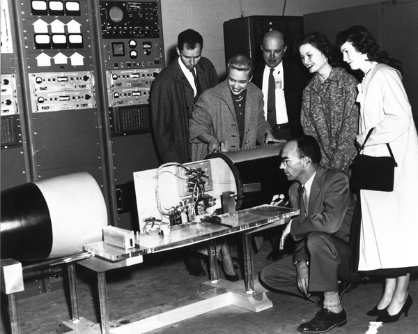 visitors inspect telemetry display at 1959 event