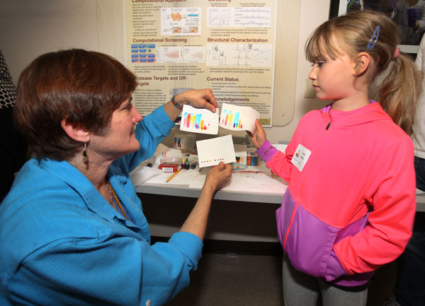 woman and child examine exhibit