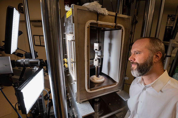 researcher works on ductile metals in lab