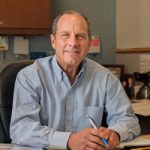 Steve Girrens sits behind his desk