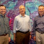 Huizenga and Sandia executives pose for photo during tour