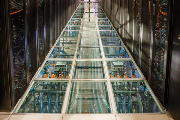 water tubes running beneath the floor of the data center