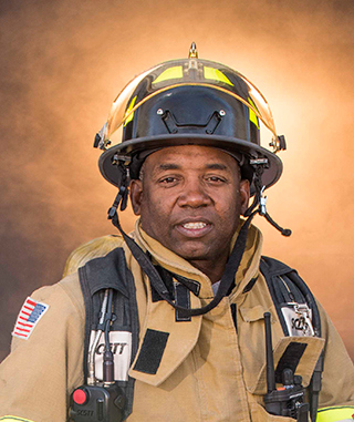 A five-man Emergency Response Team from Sandia (left to right in team photo, above), including, John Ledet (pictured here), Dale Larez, Victor Marquez, Richard Lovato, and Troy Hamby nabbed top technical honors at the recent 19th HAZMAT Challenge at Los Alamos National Laboratory. (Photo by Randy Montoya)