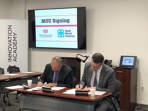 PROJECT MANAGEMENT MOU — Associate Labs Director Scott Aeilts and UNM’s Dean Craig White signed a memorandum of understanding to support project management education and professional development. (Photo courtesy of UNM)