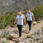 two people in masks participate in virtual walk