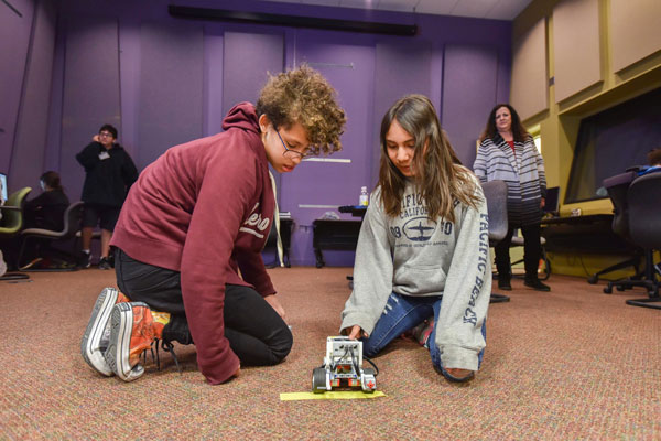 students test robot vehicle