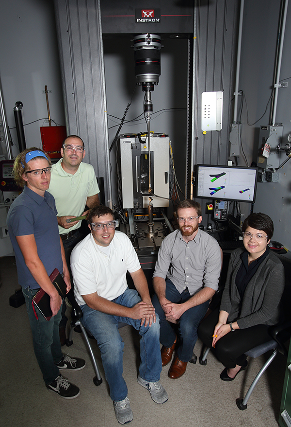 COMPOSITE COLLABORATERS — Sandia scientists and engineers continue to collaborate on fracture, failure of advanced structural materials. They include, from left, Alex Hanson (8259), Tim Briggs (8222), Brian Werner (8343), Shawn English (8248), and Stacy Nelson (8259). (Photo by Dino Vournas)