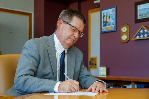 Peery signs assessment letter