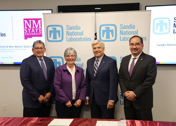 Sandia and NMSU execs at signing event