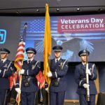 Honor guard presents flags