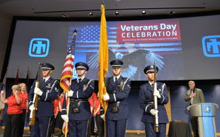 Honor guard presents flags