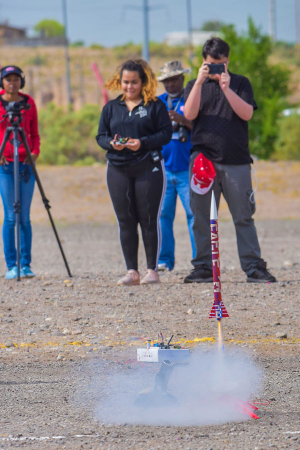 students photograph rocket launch