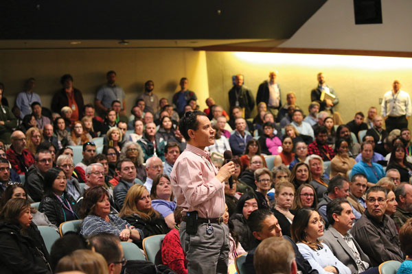 audience member stands to ask question