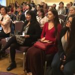 A group of women listen to a speaker at the World Congress of Computational Mechanics