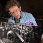 optical scientist works on microsopy equipment