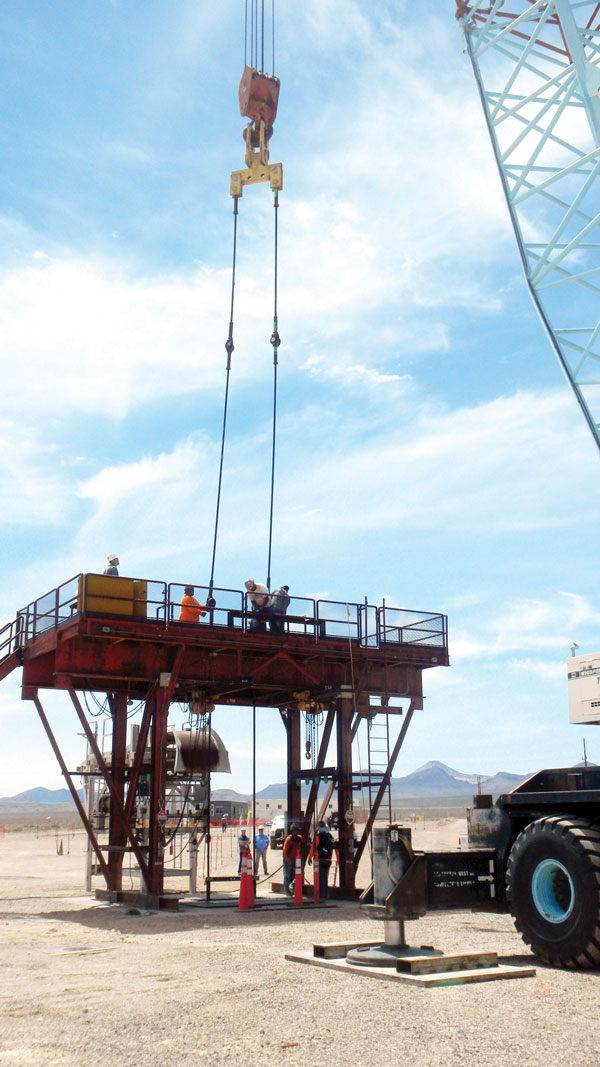 researchers work on drill rig to set up borehole test