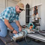 scientist works on SWEPT lab equipment