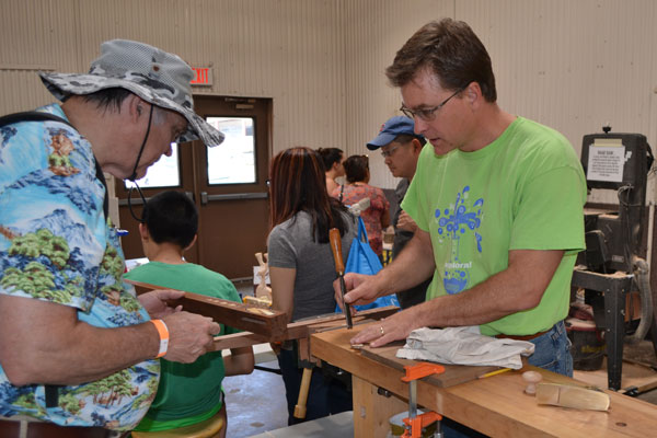 Aaron Hall demonstrates wood working technique