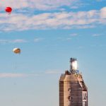 Balloons fly near solar tower