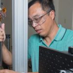 Bo Song in engineering lab