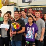 Miguel Baez and students celebrate his award in classroom