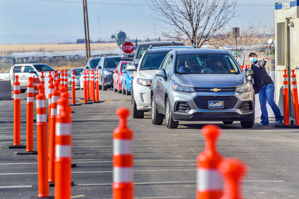 cars line up at vaccine clinic