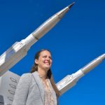 Justine Wolff stands in front of missile display