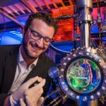 Sandia scientist inspects gold sample