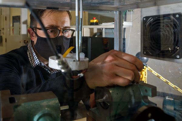 researcher testing high-voltage connector